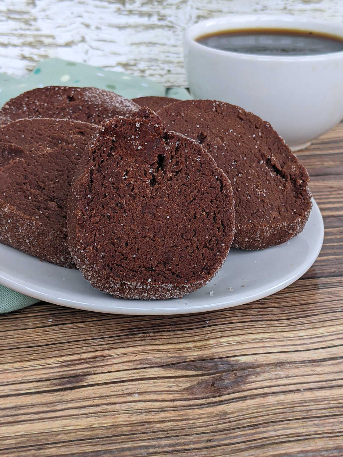 a closeup of several salted chocolate shortbread cookies on a white plate