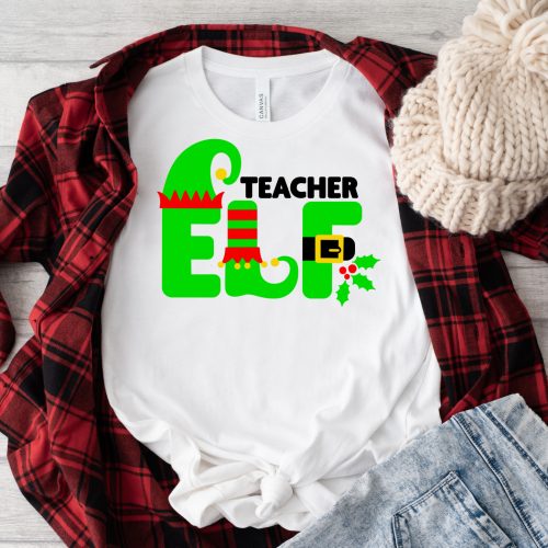 White shirt with Teacher Elf design under a flannel