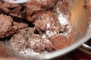 chopped chocolate added to salted chocolate shortbread cookie douh
