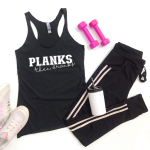 black workout clothes with a Planks Then Dranks design on the tank top