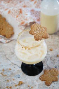 gingerbread man cookie balanced on a gingerbread cocktail