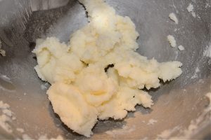 creamed butter and sugar in a metal bowl