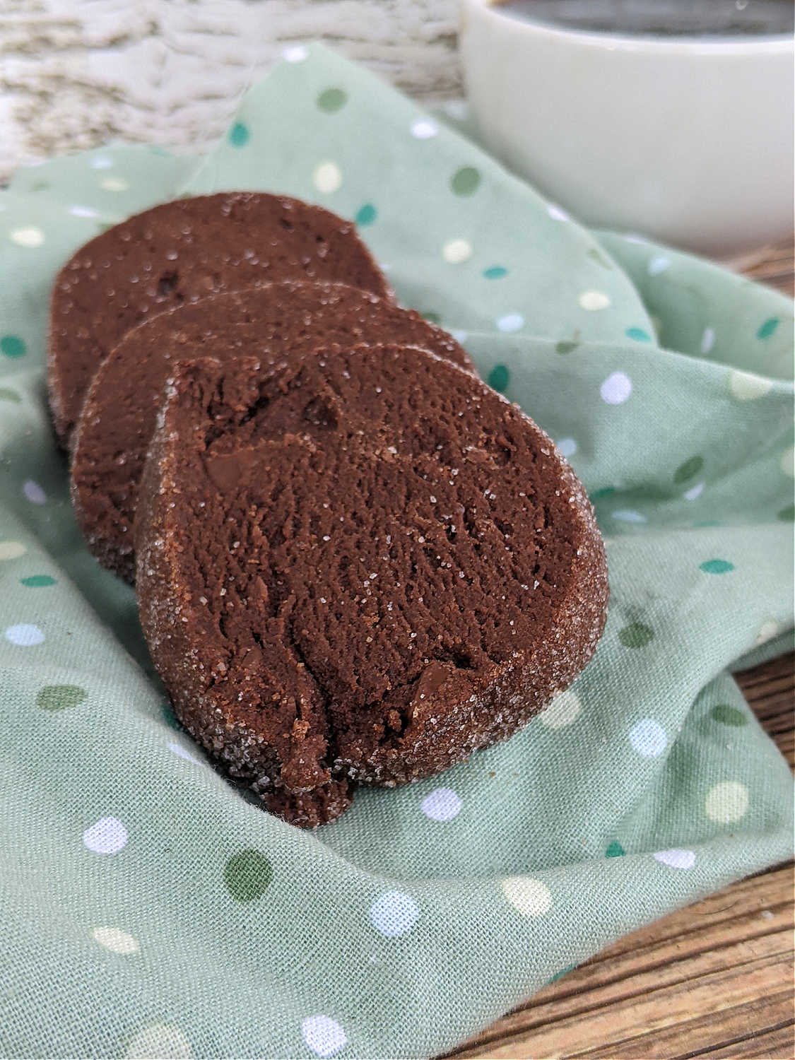 several salted chocolate shortbread cookies on a green polka dot napkin