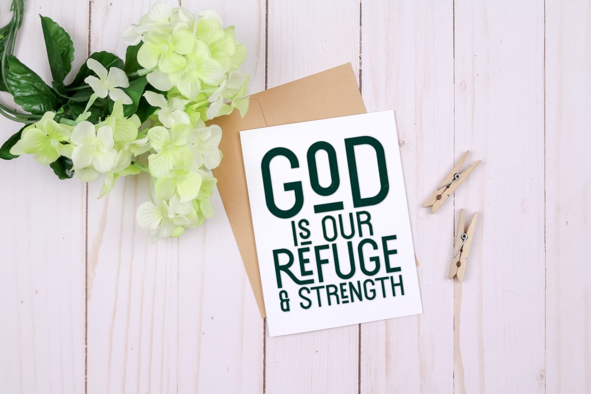 White greeting card that says "God is our refuge & strength"