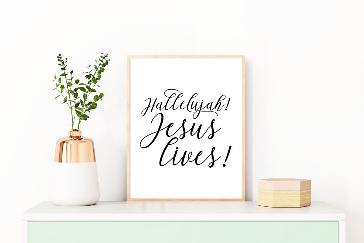 Jesus Lives SVG in a wood frame on a shelf