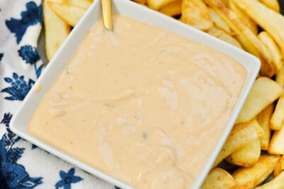 close up of bowl of homemade in-n-out sauce near french fries