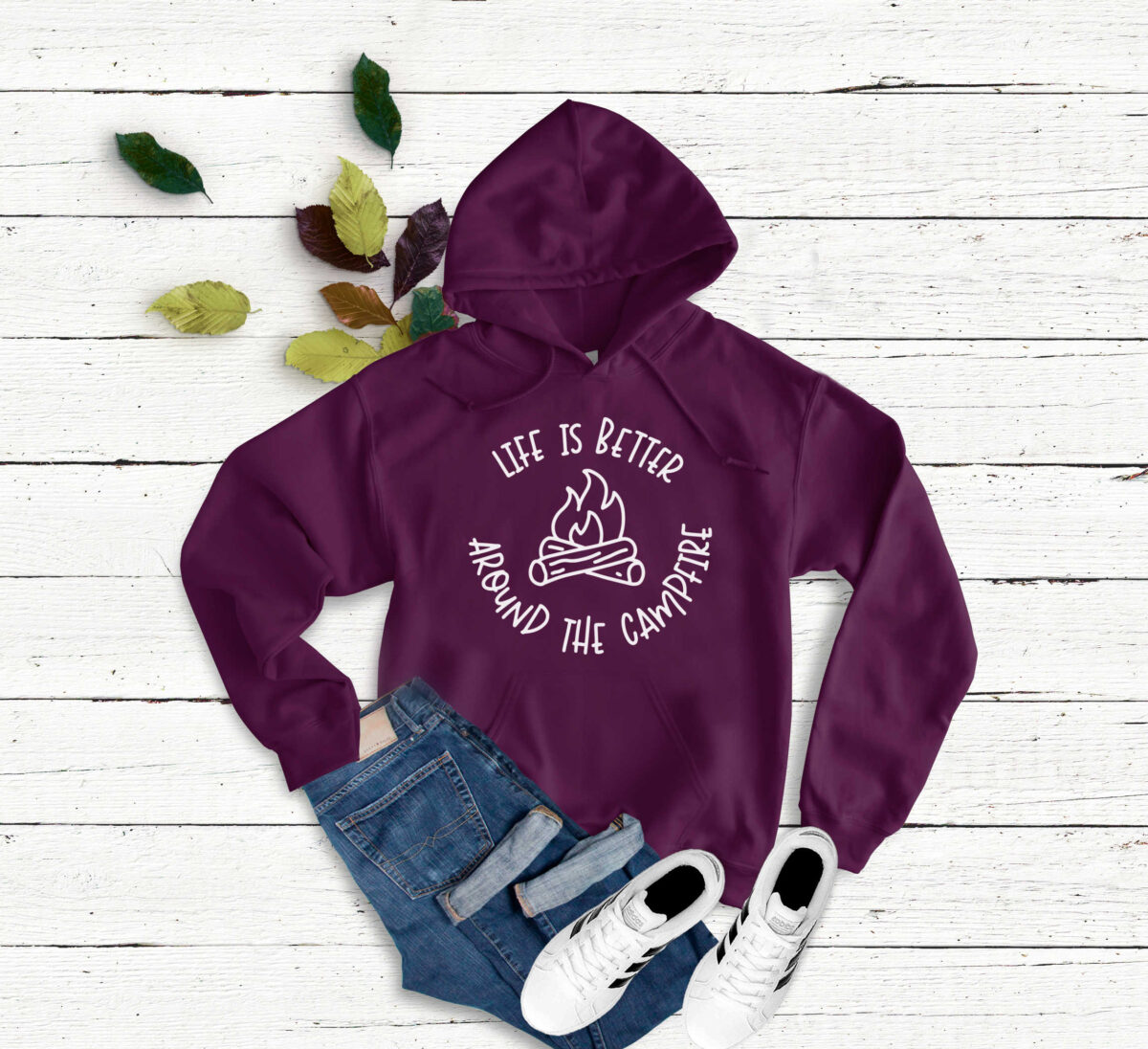 Life is Better Around the Campfire SVG on a burgundy sweatshirt