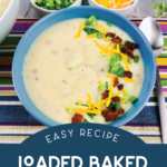 top down view of a bowl of loaded baked potato soup in a blue bowl