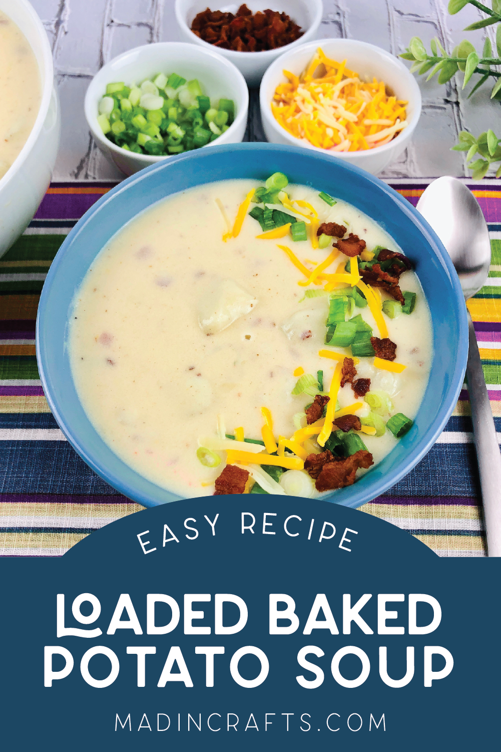 top down view of a bowl of loaded baked potato soup in a blue bowl