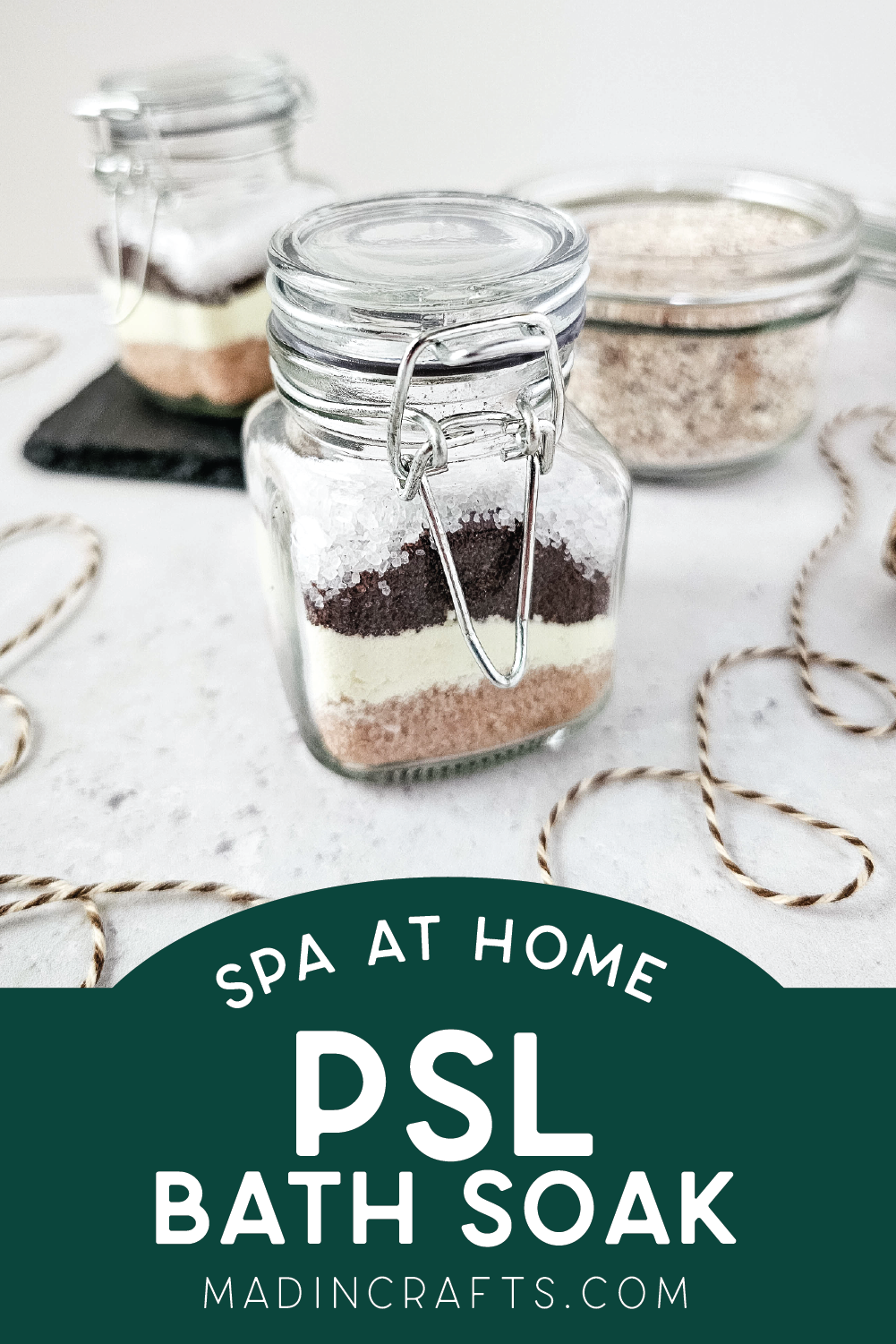 several glass containers of pumpkin spice latte bath soak