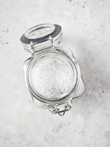 glass container with lid holding epsom salt