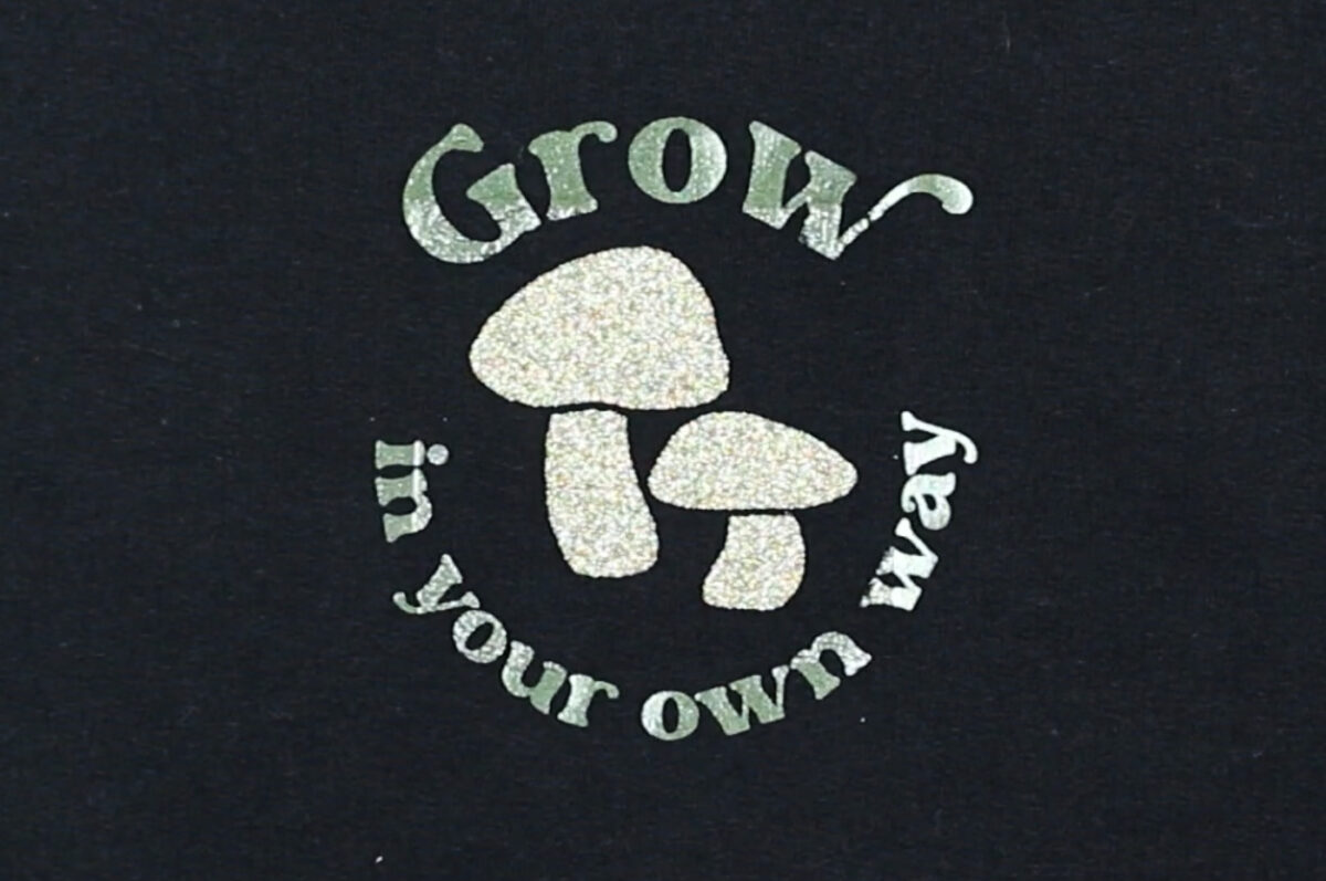 Grow in Your Own Way pocket design on a black sweatshirt