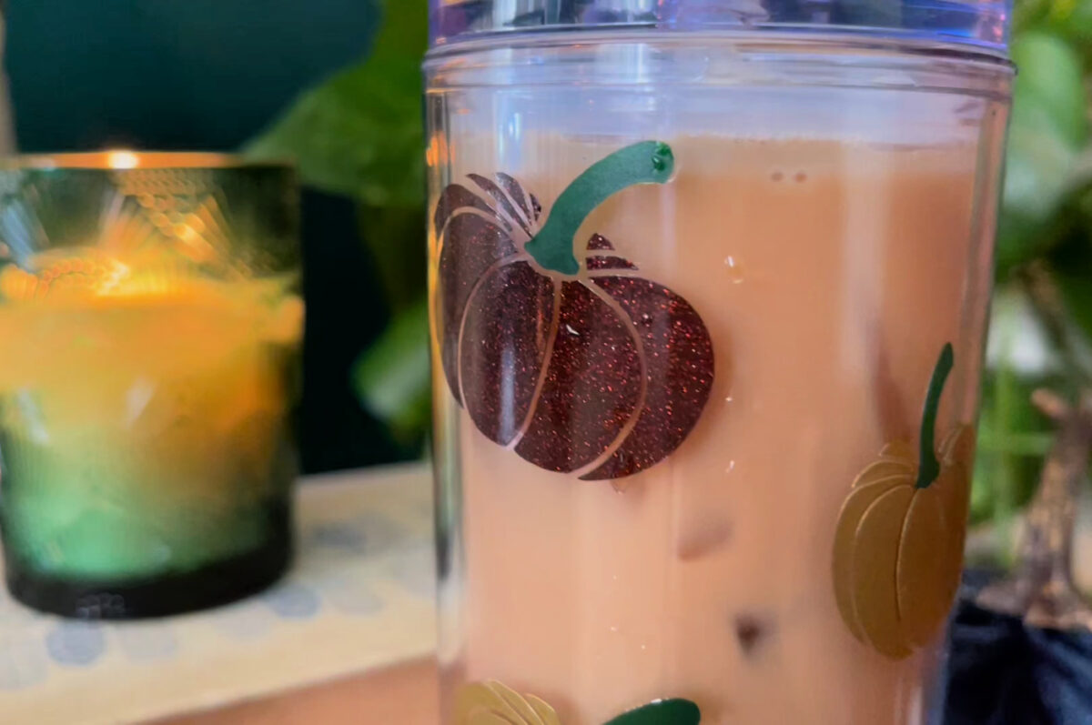 close up of pumpkin vinyl on a clear tumbler