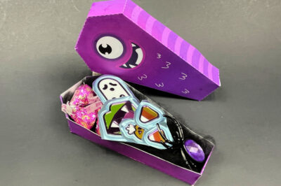 side view of a monster favor box filled with Halloween terats