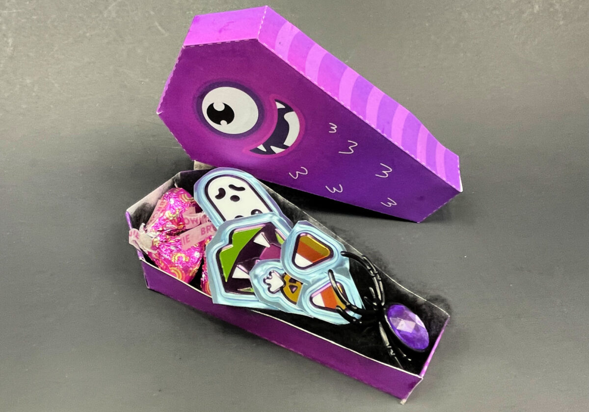 side view of a monster favor box filled with Halloween terats