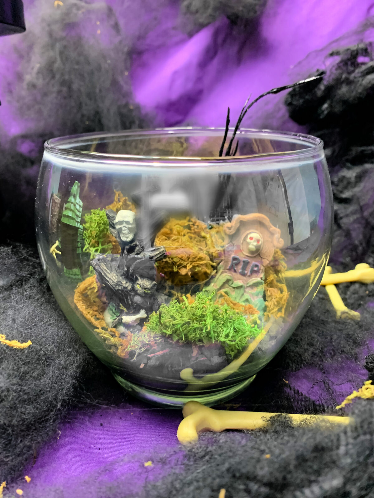 close up of a halloween terrarium made with dollar store items