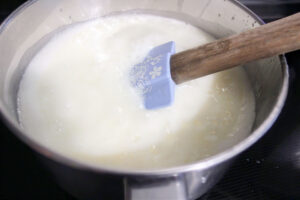 spatula stirring a mixture in a saucepan