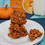 close up pumpkin no bakes and one cookie with a bite taken out of it