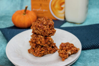 close up pumpkin no bakes and one cookie with a bite taken out of it