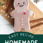 gingerbread man shaped bottle of homemade irish cream near Christmas decor