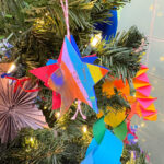 colorful painted christmas ornament on a tree