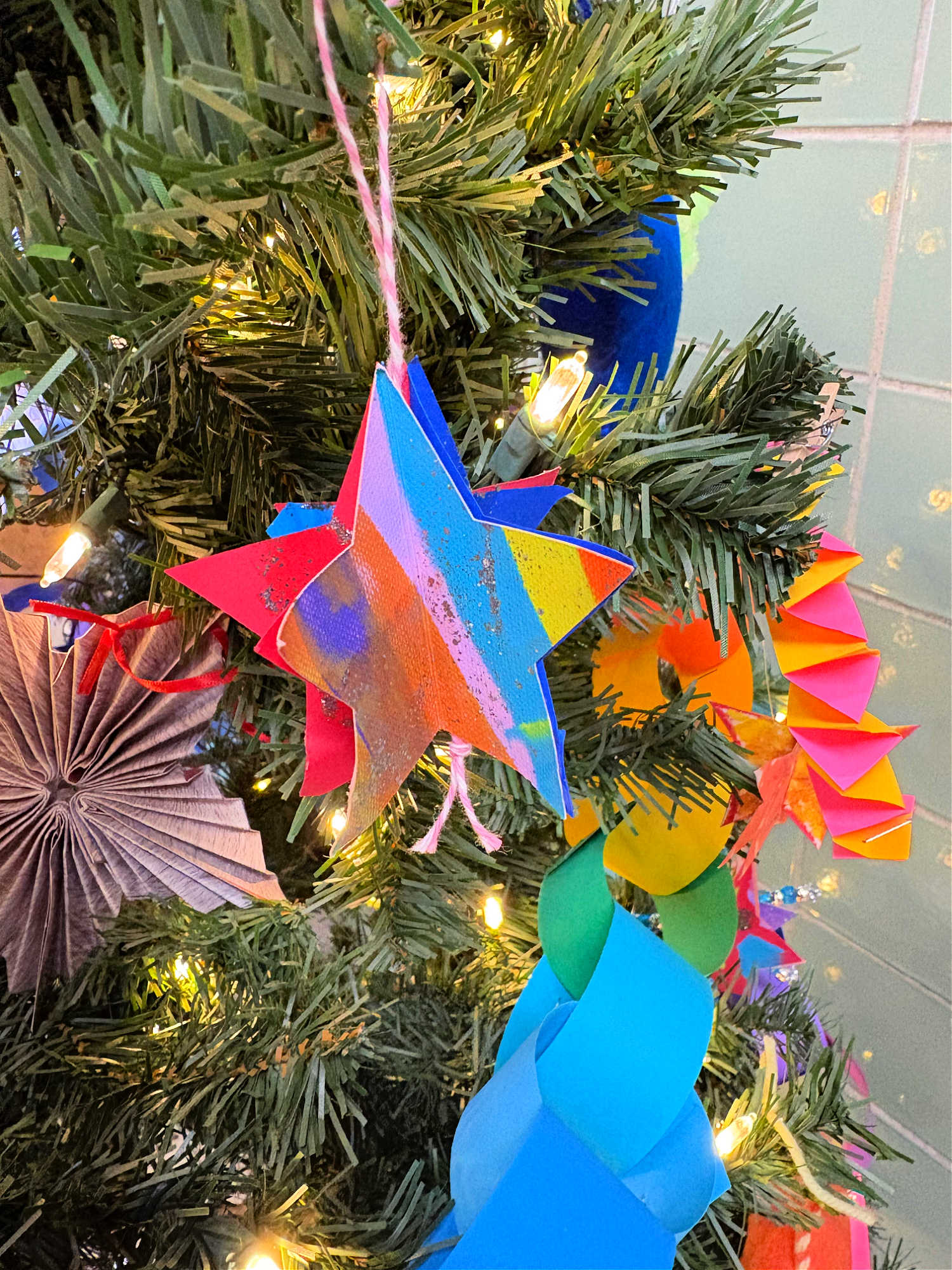 colorful painted christmas ornament on a tree