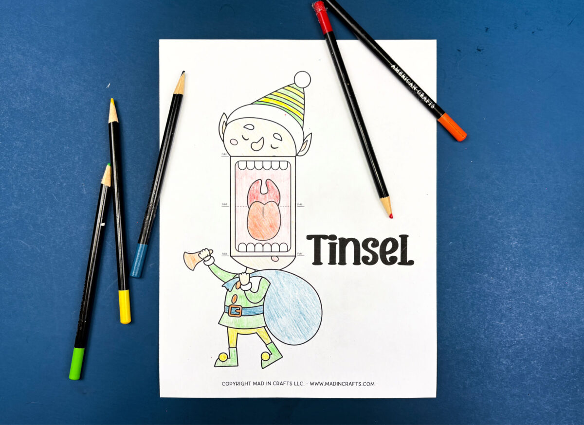 colored elf puppet printable on a blue background