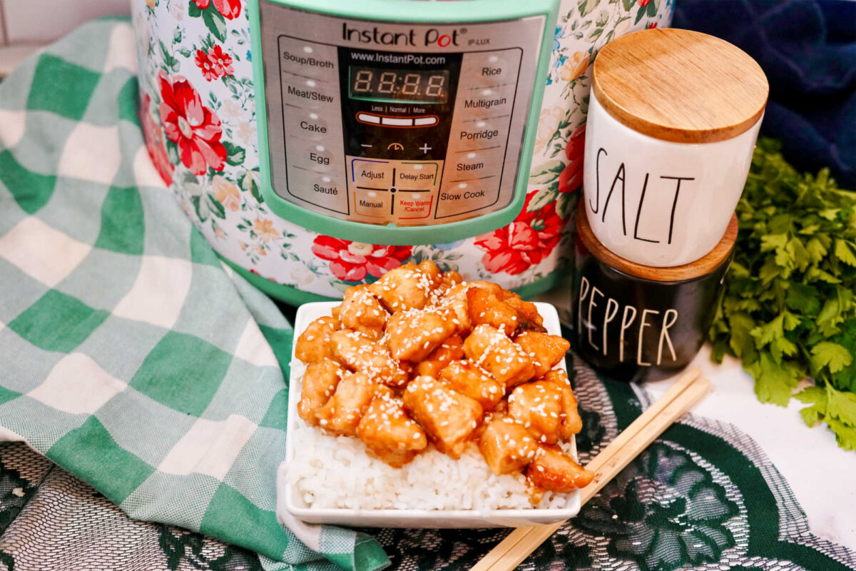 a plated serving of firecracker chicken near an instant pot