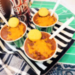 three football themed paper bowls of chili