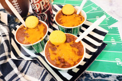 three football themed paper bowls of chili